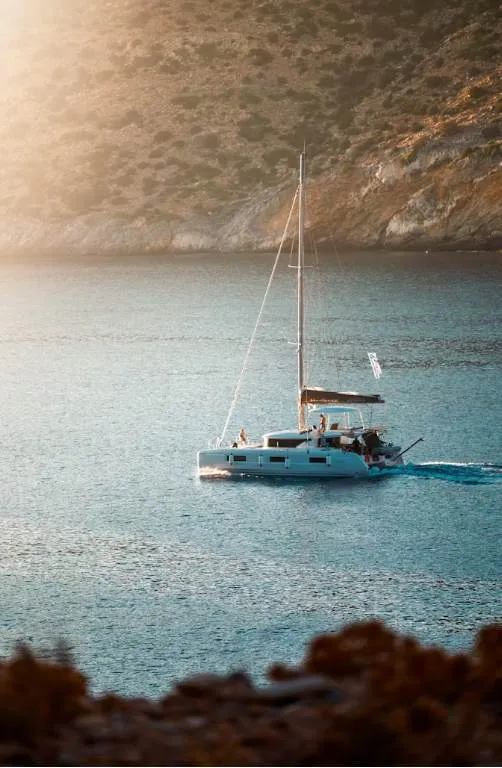 catamaran at sunset, group on deck